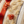 Close-up of a textured fabric with floral patterns and color stripes.